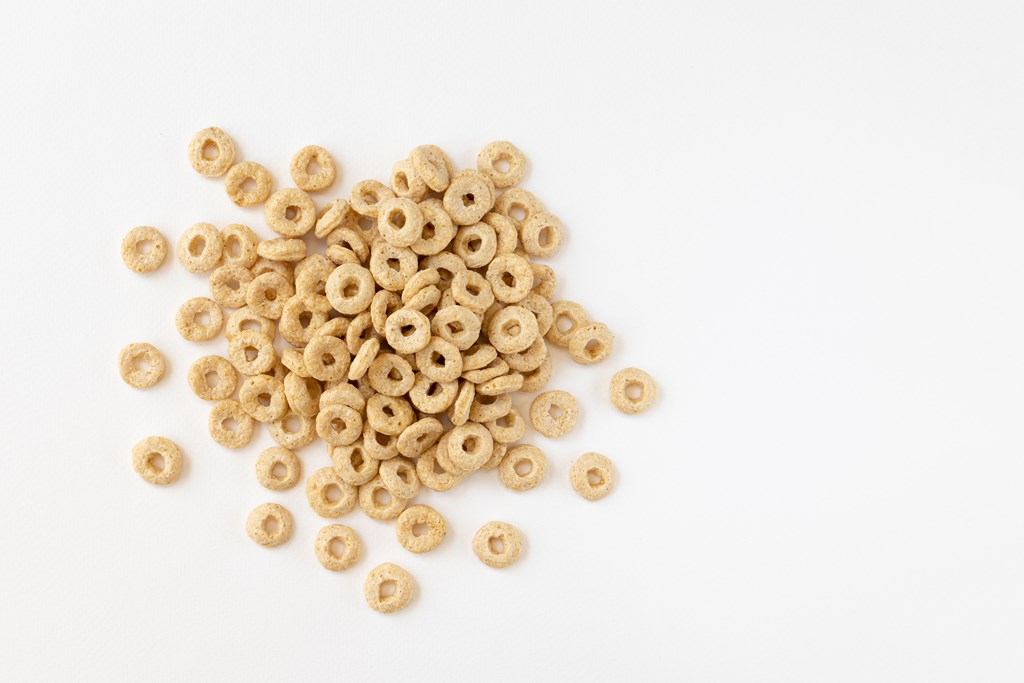 A pile of cheerios on a white background.