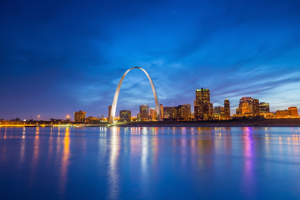 The skyline of downtown St. Louis and the Gateway Arch in the evening.