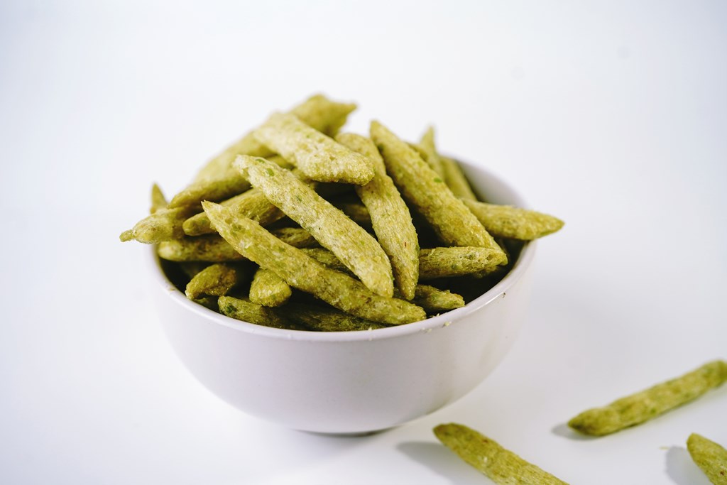 Green snap pea chips - healthy snacks, selective focus
