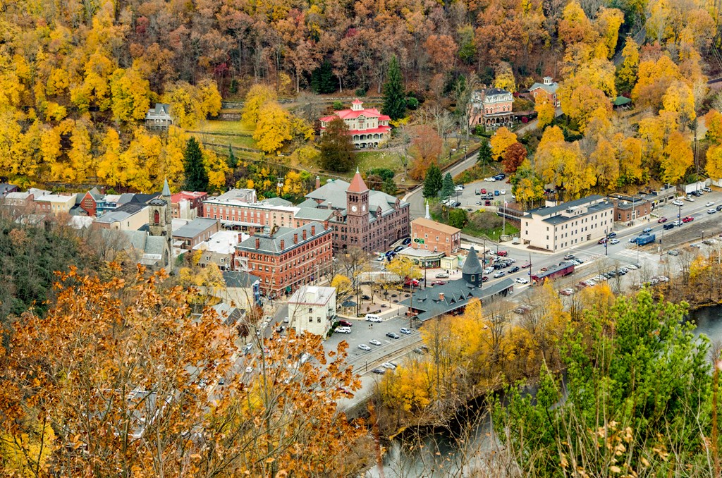 An aerial view of the small town of Jim Thrope, Pennsylvania surrounded by fall foliage.