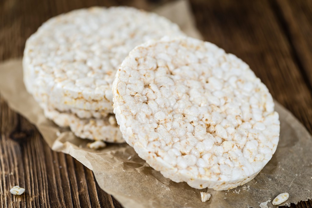 Some Rice Cakes (close-up shot) on an old wooden table.