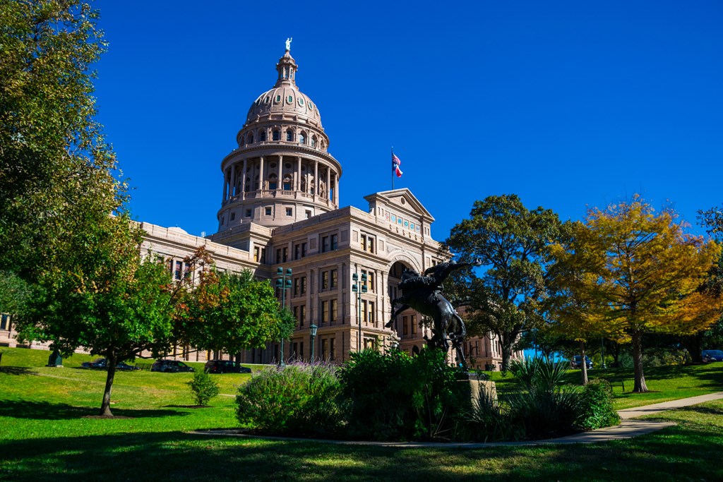 Texas State Capitol Building in Austin, Texas as leaves start to change in the fall.