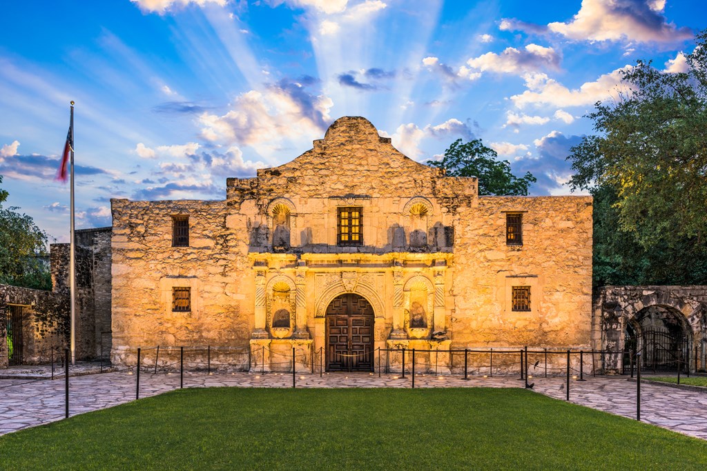 Sun rays shine behind the Alamo in San Antonio, Texas.