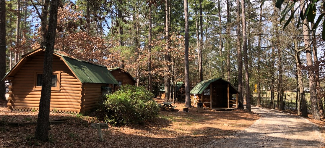 Camping Cabins are grouped together, close to the bath house in the A-frame. RV sites are across street so families and friends can camp nearby!