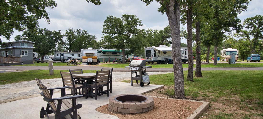 Deluxe Patio Site come with outdoor seating, fire pit, and gas grill.