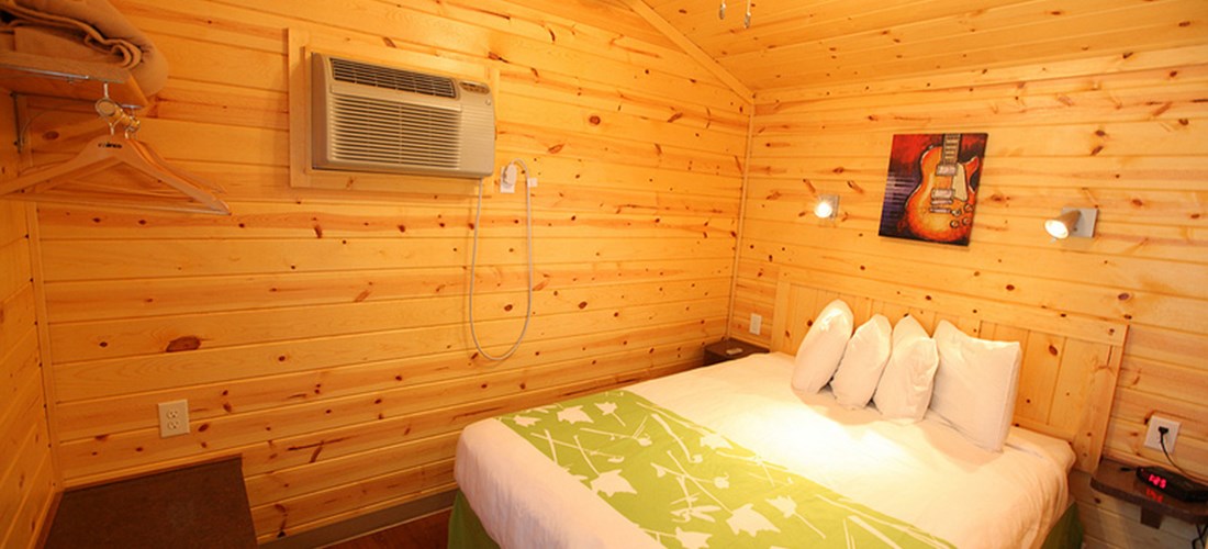 This cabin has a private bedroom with queen bed.