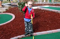 This little guy is mini-putt crazy!