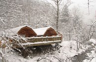 Warm yourself near the fireplace in our cottages