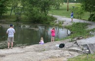 Children fishing with dad