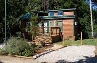 Outside landscaped view of Deluxe Cabin