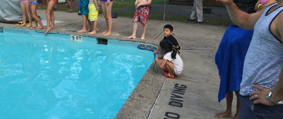 Kids were warned of bitter cold water after 800lbs of ice was dumped into the normally heated pool.