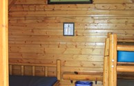 Interior of one of our charming one room camping cabins...we have log cabins and cottages.