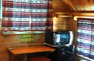 Interior of one of our charming one room camping cabins...we have log cabins and cottages.