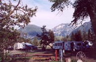 Looking through the shady full hookup sites towards the Absaroka Mountains.