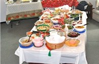 Holiday pot luck salads and desserts table
