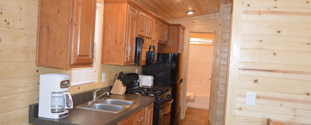 Enjoy the comfort of home with the Deluxe Family Lodges full kitchen!