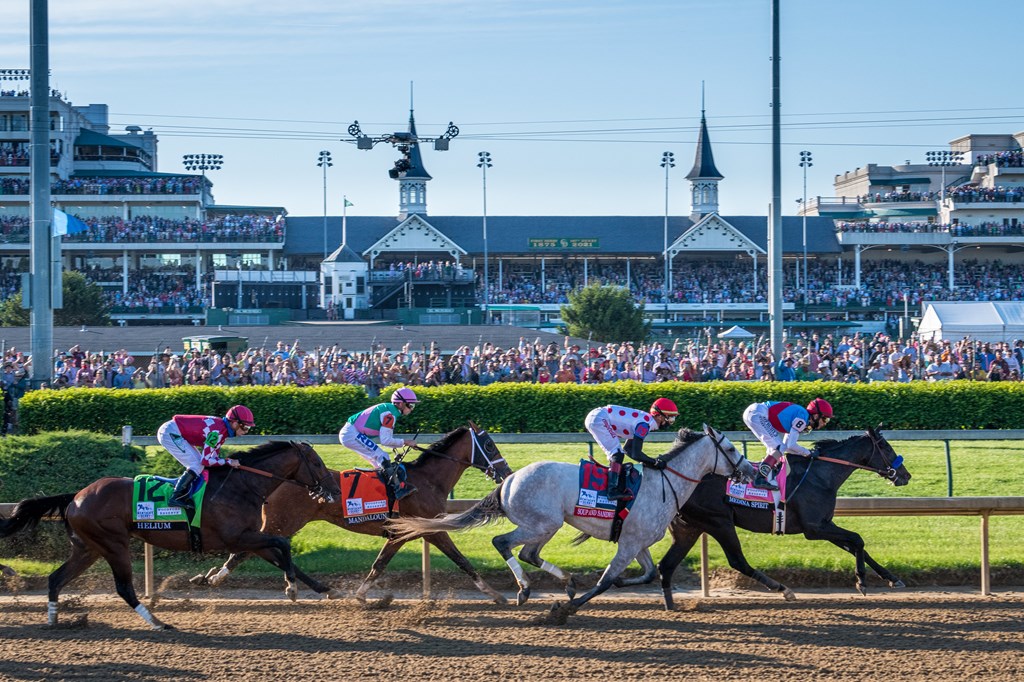 Horses run along the backstretch of the 2021 Kentucky Derby.