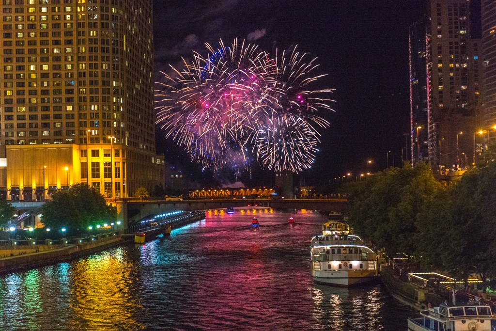 The fireworks are flying high above the Chicago River during the annual memorial weekend event at Navy Pier.