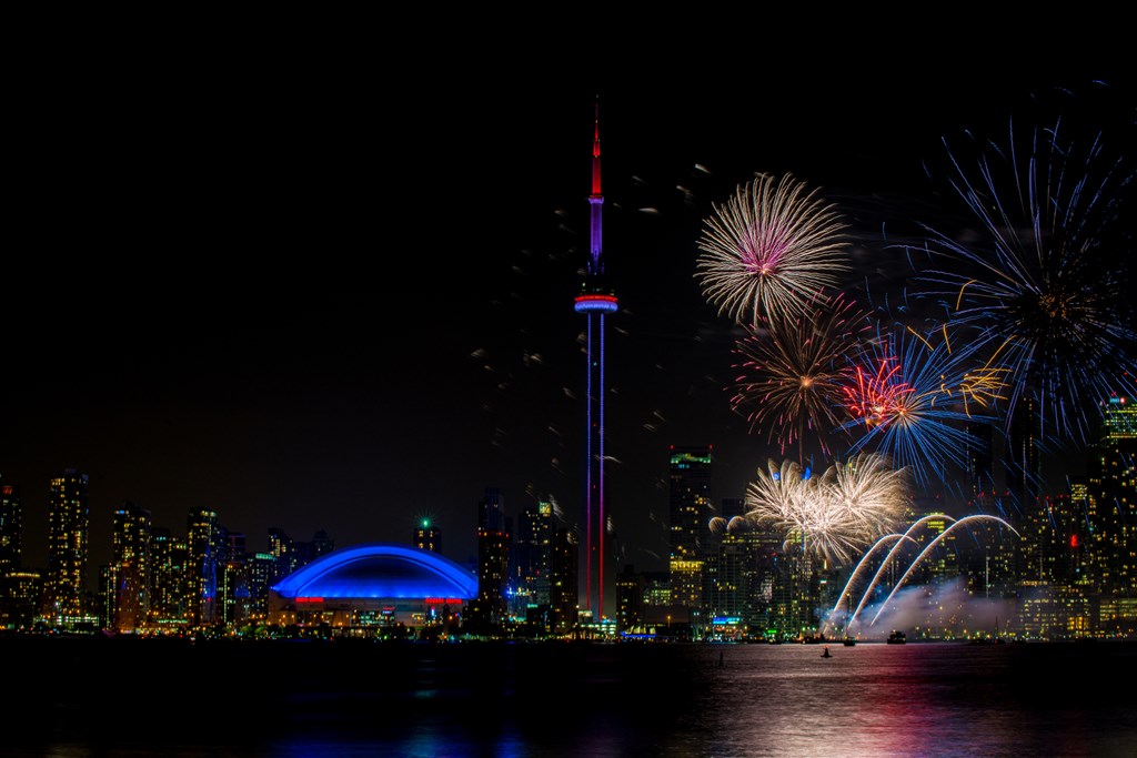 Colorful fireworks with CN Tower at night in Toronto Canada