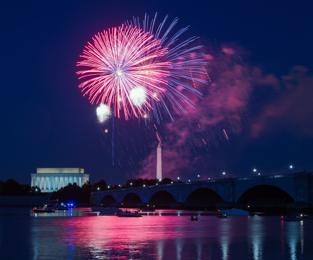 Nighttime image of Independence Day fireworks over the Washington Monument and Lincoln Memorial in Washington, DC.