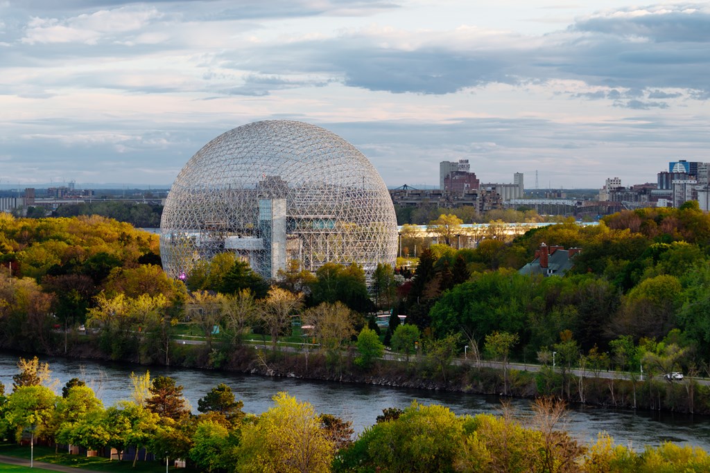 Drone view of Montreal Biosphere at the Park Jean-Drapeau, with the downtown of Montreal in the background. Quebec, Canada.