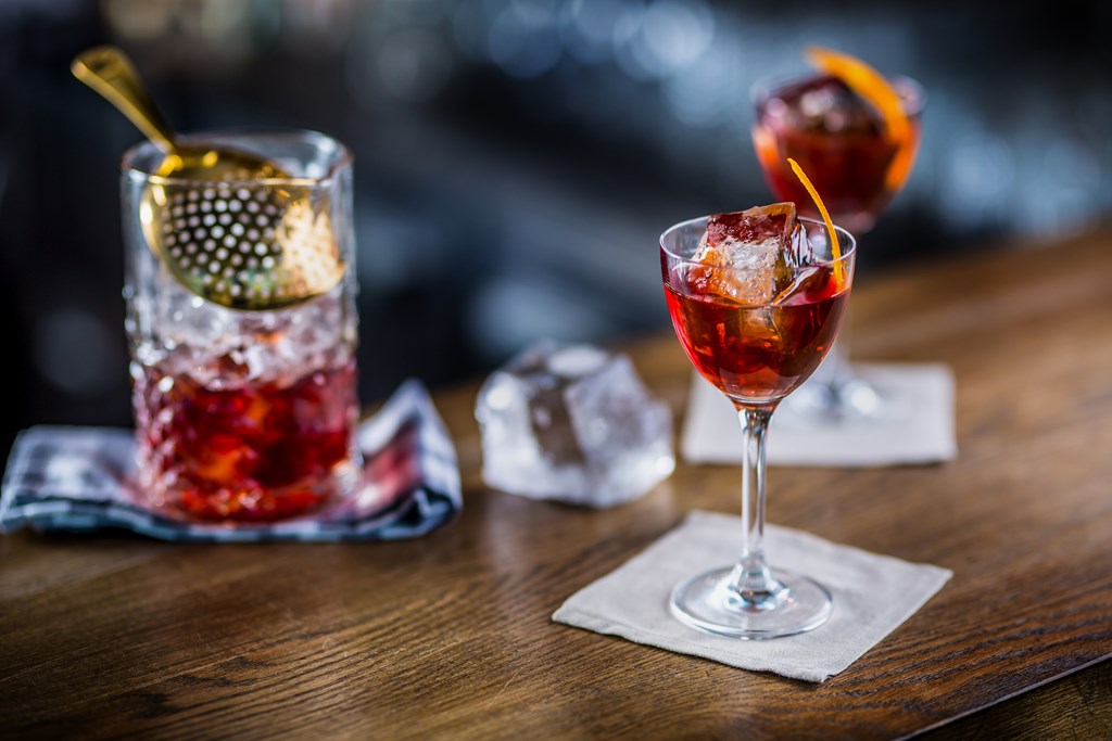 Cocktail drink decorated on bar counter in pub or restaurant.