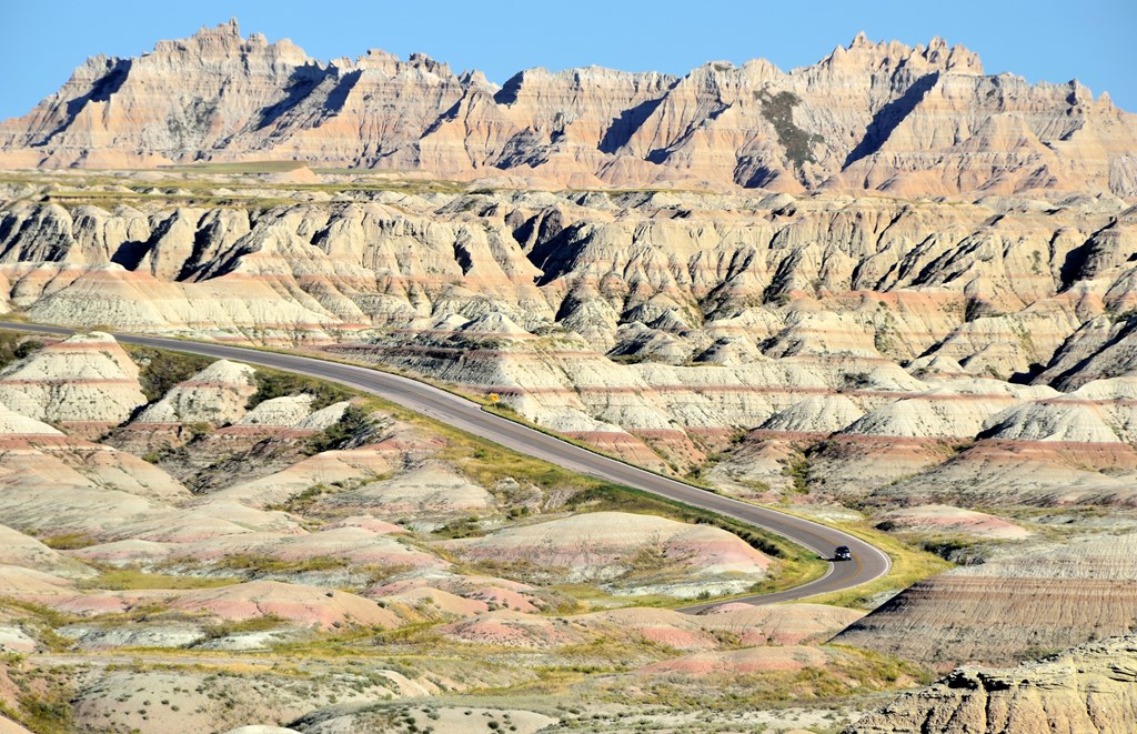 A car winds its way through the Badlands National Park in South Dakota.