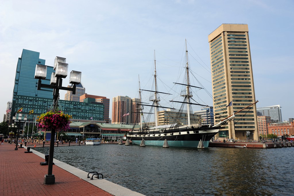 View of Baltimore Harbor with USS Constellation Ship and office buildings