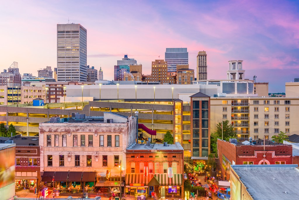 Memphis, Tennessee, USA city skyline over Beale Street at dusk.