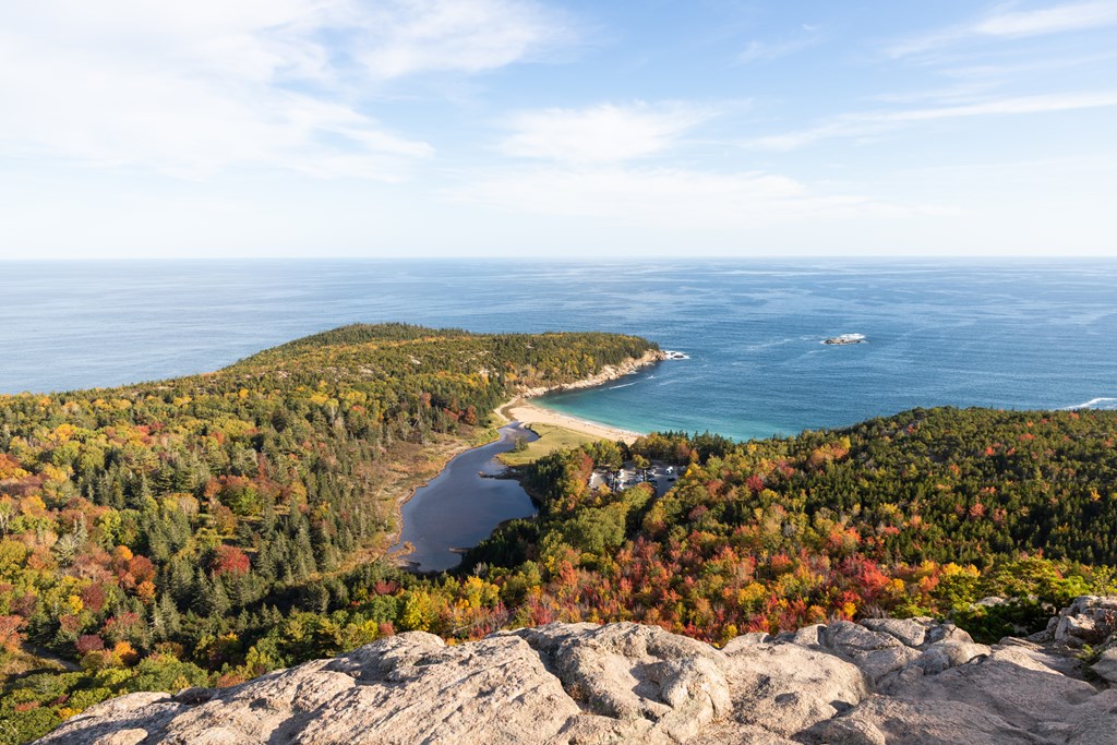Fall foliage and beautiful water on the Beehive Trail in Acadia National Park in Maine.