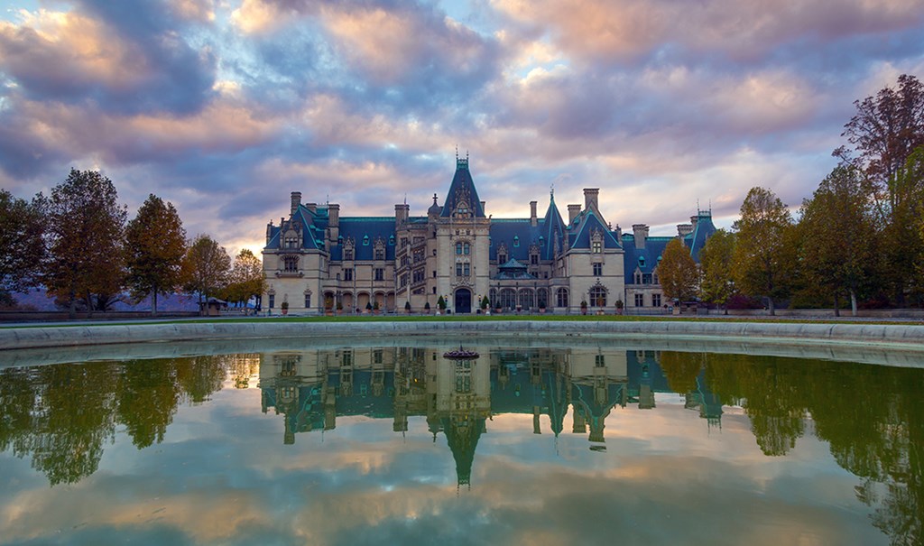 A large mansion under a cloudy sky.