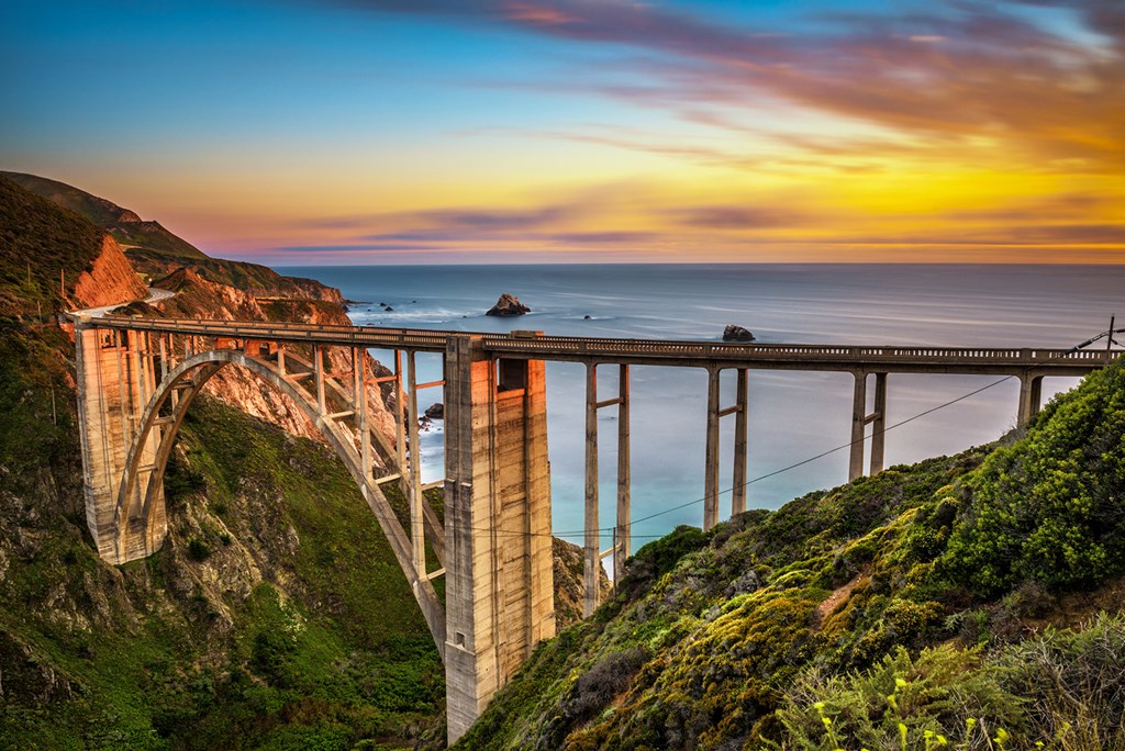 Bixby Bridge (Rocky Creek Bridge) and Pacific Coast Highway at sunset near Big Sur in California, USA.