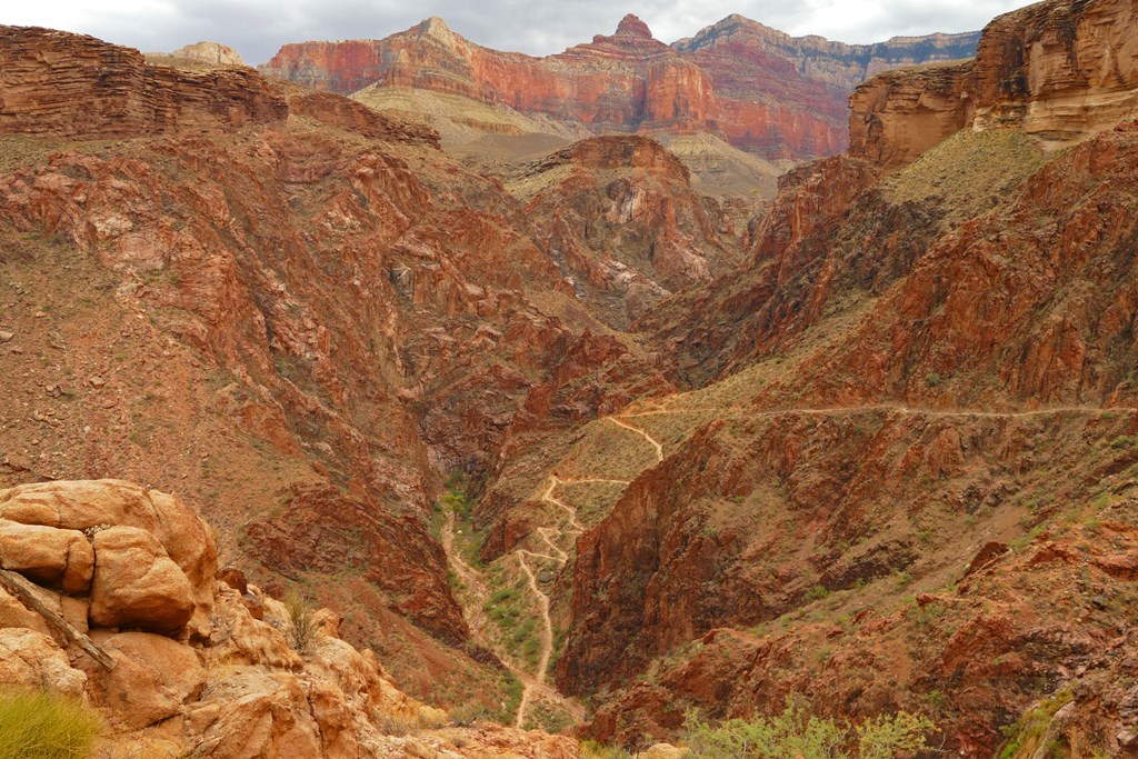 A trail winding down the Grand Canyon.