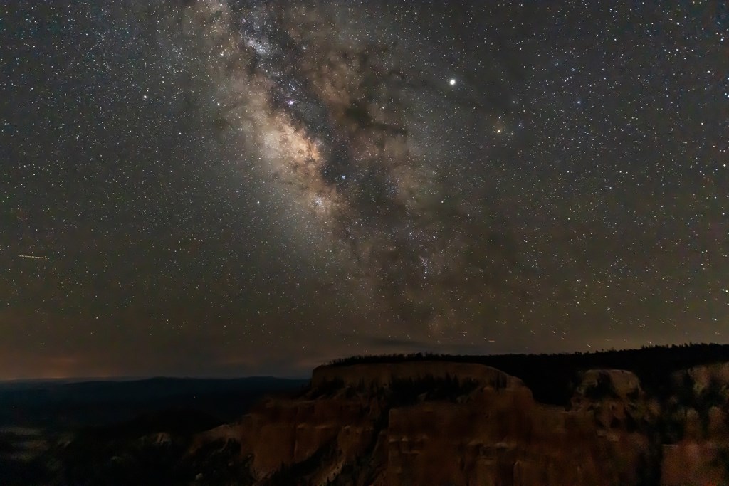 Night sky with dark milky way and shooting stars in Bryce Canyon National Park in Utah at Pariah view overlook