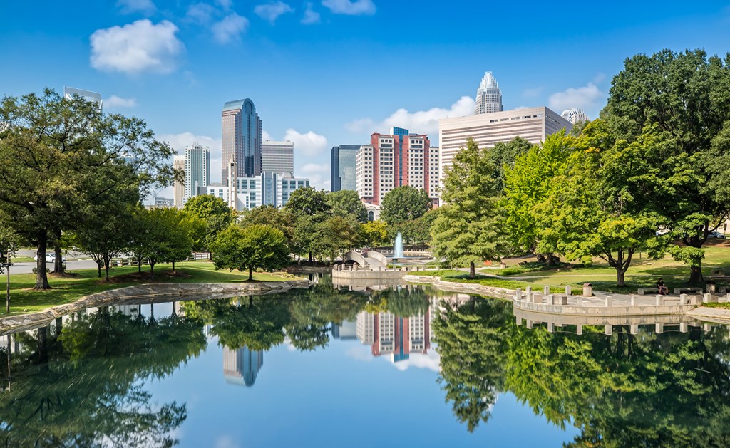 The Skyline of Charlotte is reflecting on the Water in Marshall Park