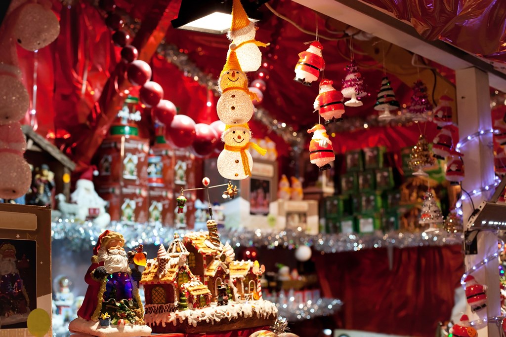Christmas decorations including many ornaments for sale in a store.