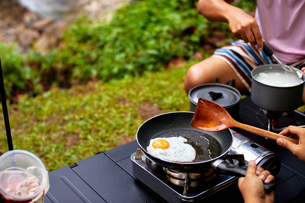 Frying egg while camping