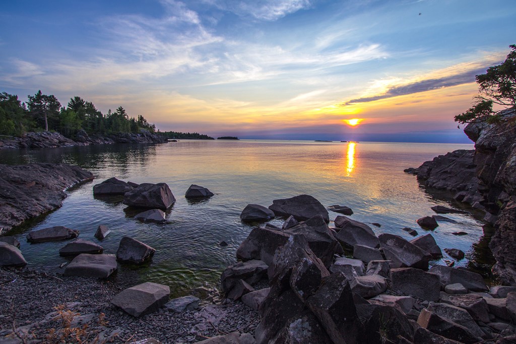 Dusk falls on the rugged shore of Lake Superior in Copper Harbor, Michigan. 