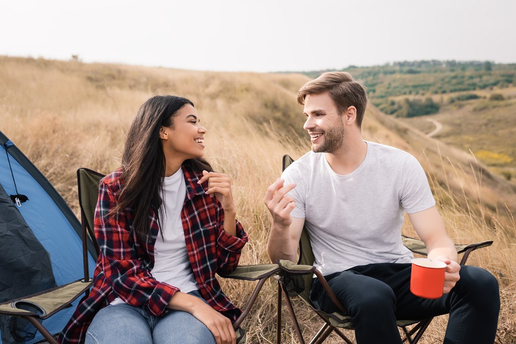 https://koa.com/blog/images/couple-chatting-will-camping.jpg?preset=blogPhoto