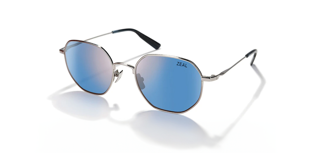 Blue lensed sunglasses on a white background.
