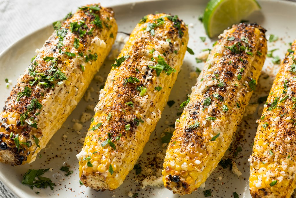 Homemade Spicy Elote Mexican Street Corn with Mayo Lime and Cheese.