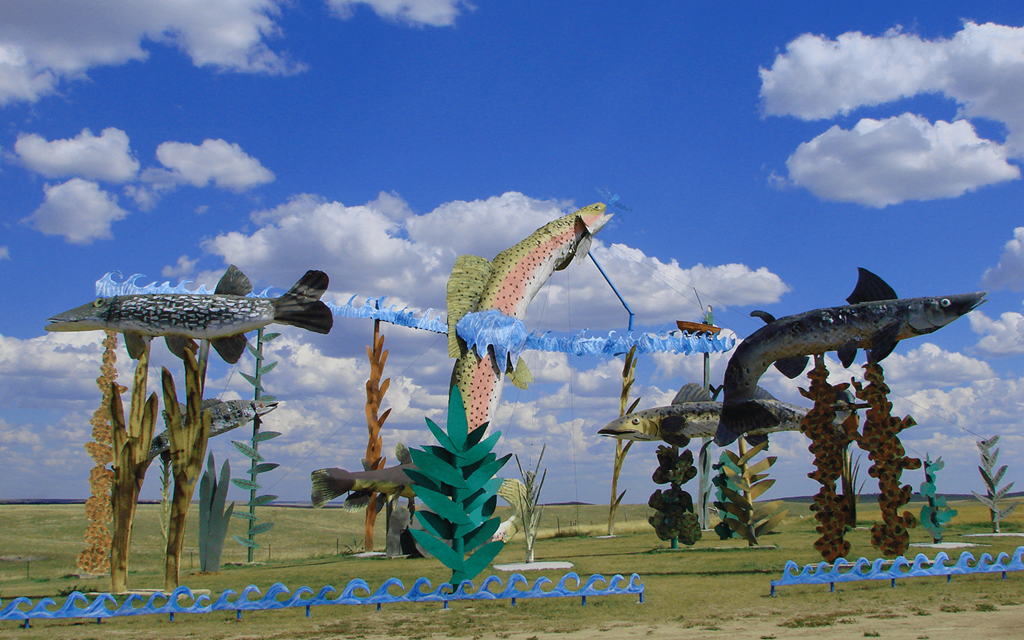 A collection of strange sculptures on the side of a road.