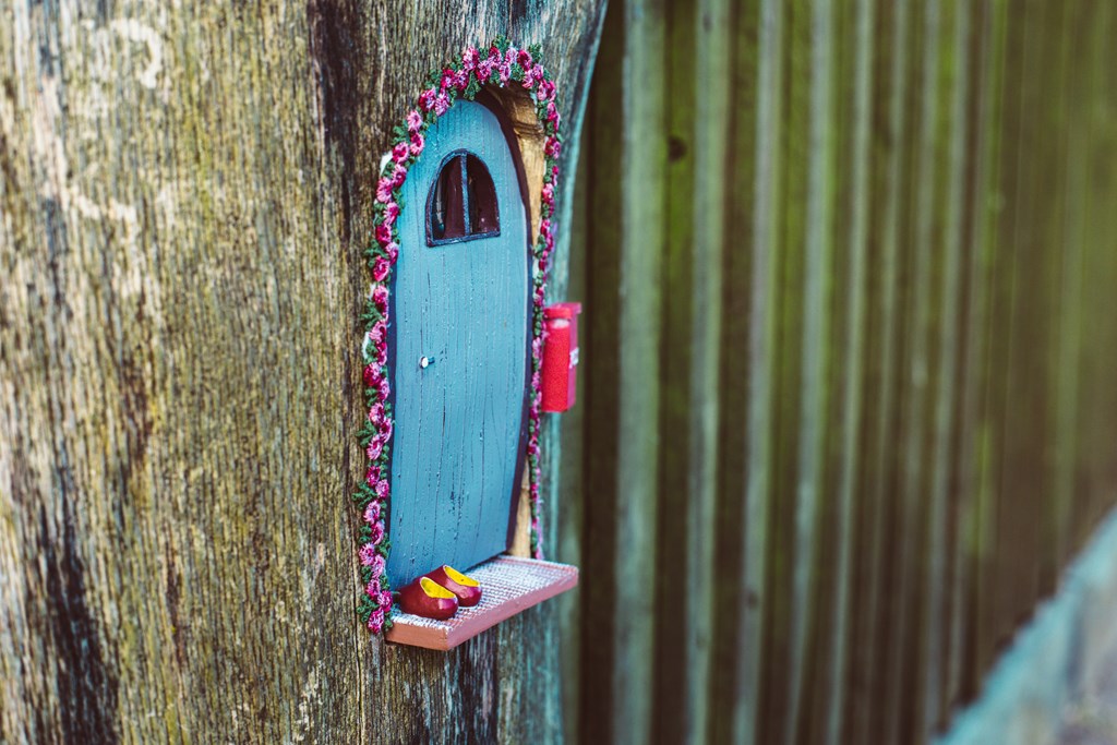 closeup photo of a tiny decorative house in the garden