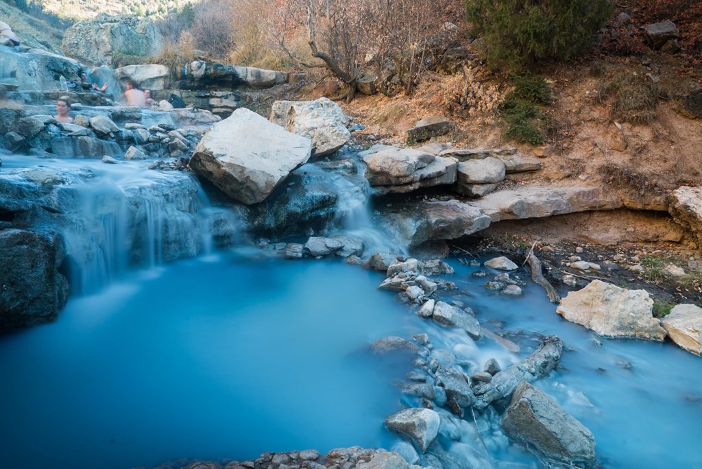 Natural hot springs shine bright blue at Fifth Water Hot Spring in Utah.