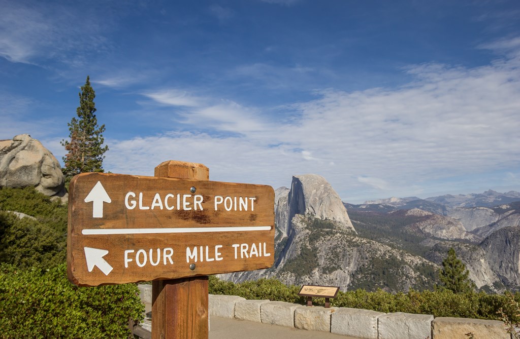 Sign at Glacier Point in Yosemite National Park marking trailheads.