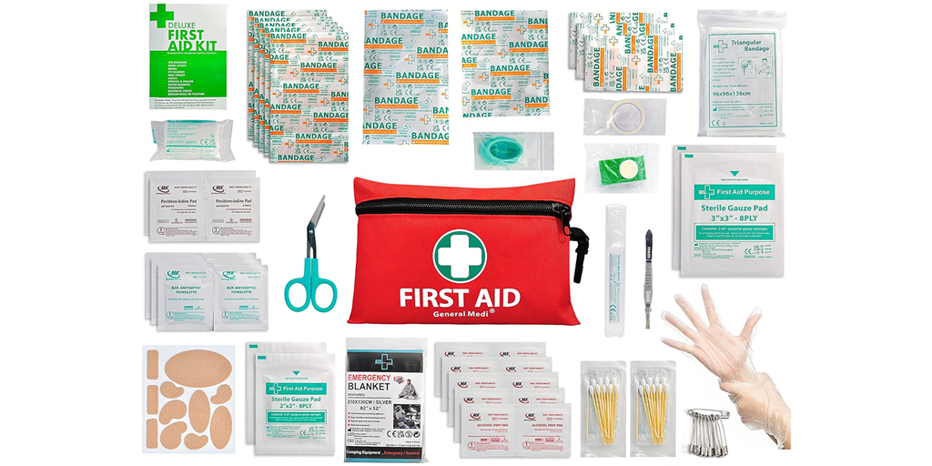A flatlay of items included in a red first aid kit.