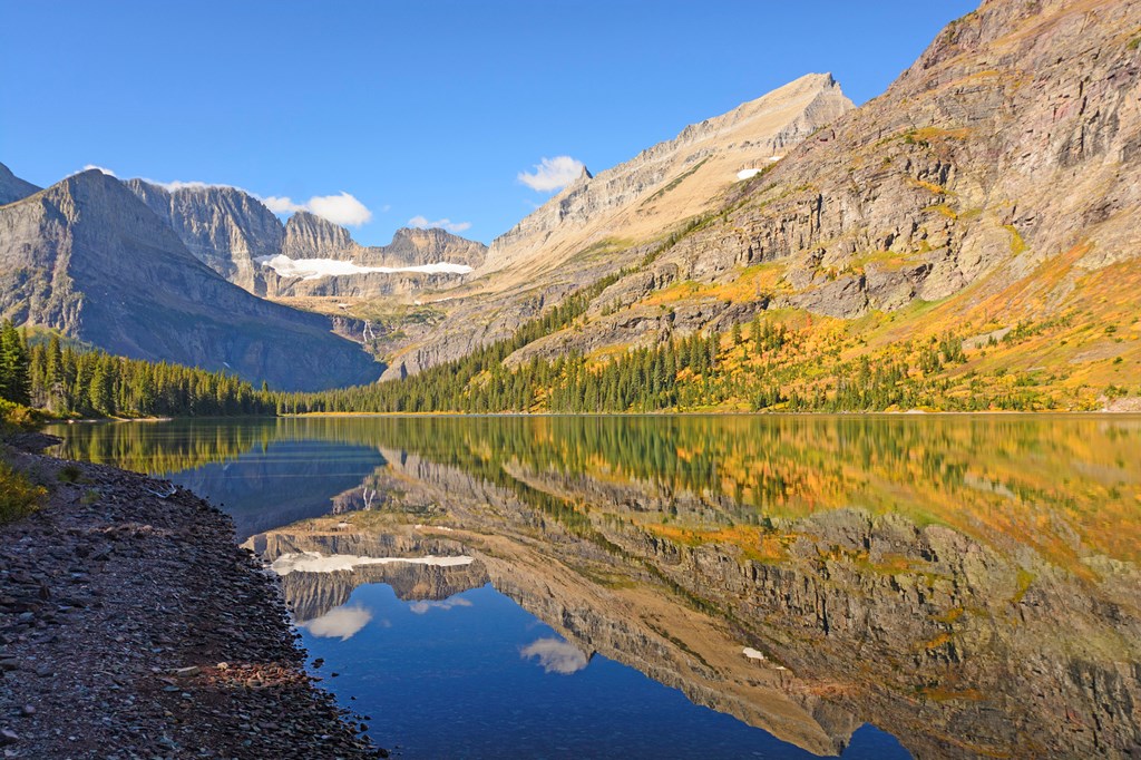 Fall Reflections in Early Morning on Lake Josephine in Glacier National Park in Montana
