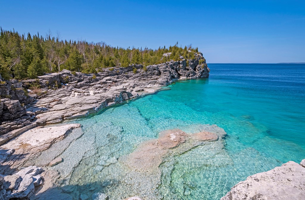 Clear Waters in a Gray Cliffed Cove at Indian Cove in Bruce Peninsula National Park in Ontario