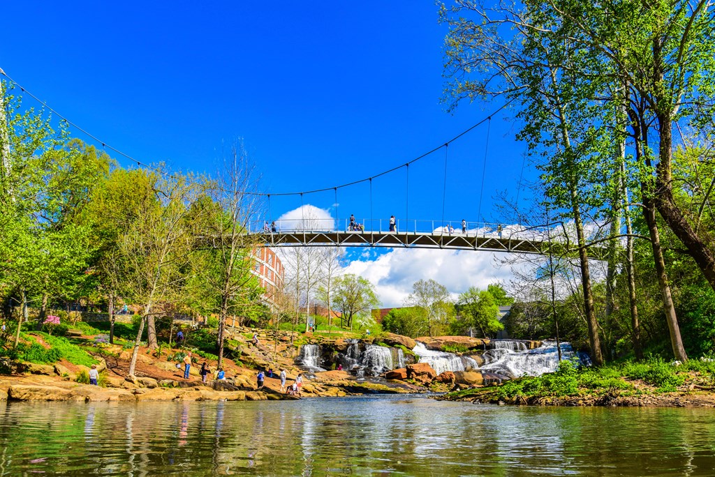 Falls Park Reedy River and Liberty Bridge Panorama in Downtown Greenville, South Carolina.