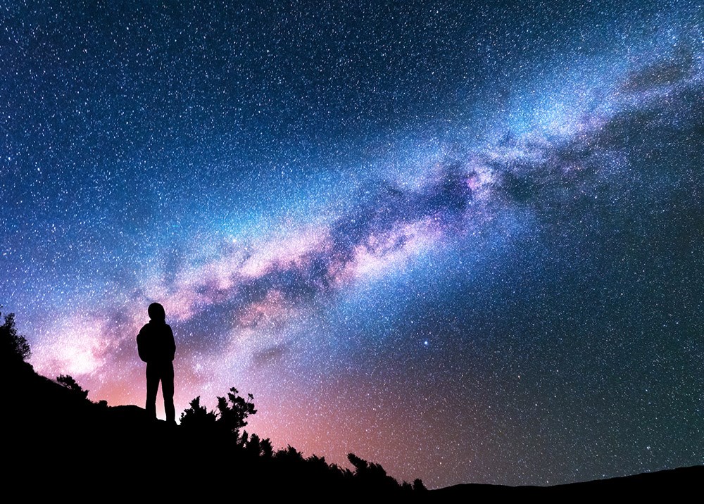 A man hiking at night.